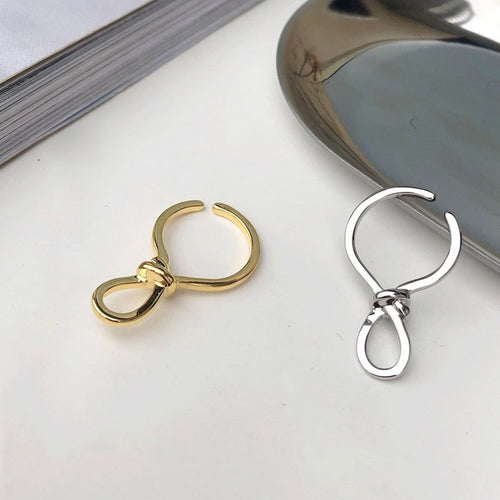 Minimalistische knoopoormanchet uit één stuk goud en zilver