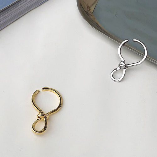 Minimalistische knoopoormanchet uit één stuk goud en zilver