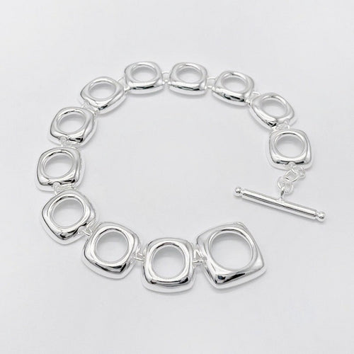 Gedurfde zilveren armband met vierkante frameschakels, perfect unisex accessoire