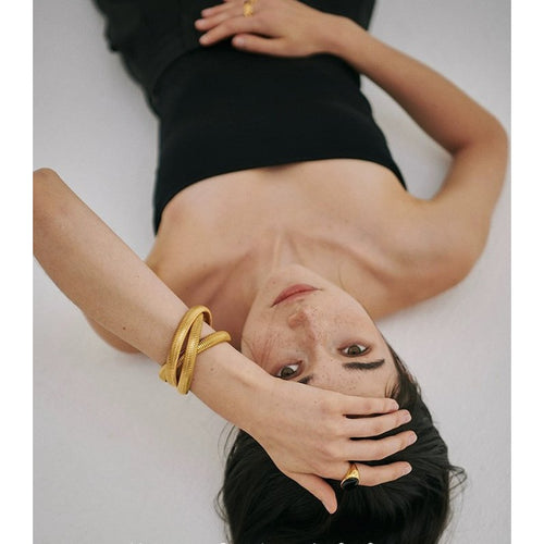 Minimalistische stretch armband met 3 strengen in goud en zilver