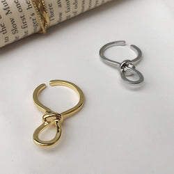 Minimalistische knoopoormanchet uit één stuk goud en zilver