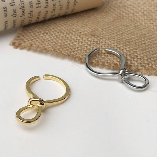 Minimalistische knoopoormanchet uit één stuk goud en zilver